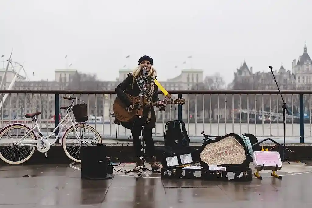 singer guitarist standing